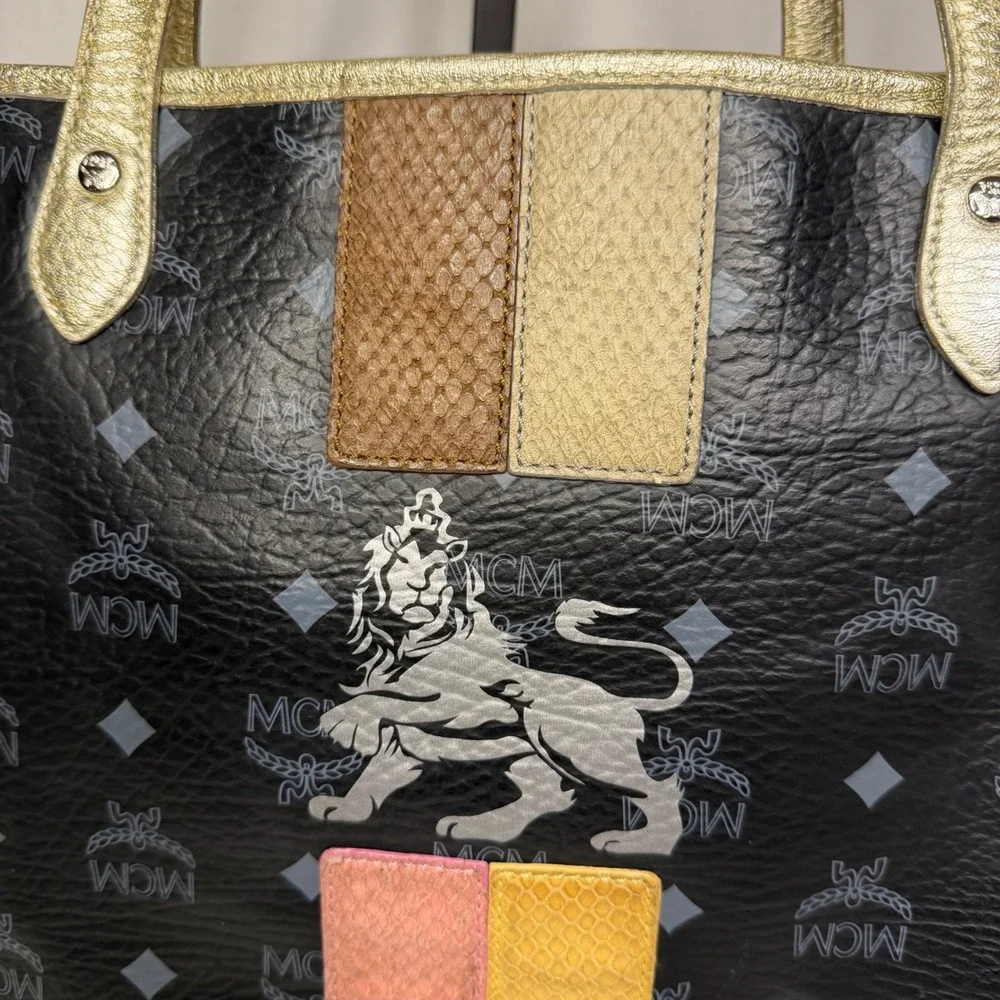 MCM Visetos Monogram Medium Tote Bag Black Gold‎ Lion Graphic Striped